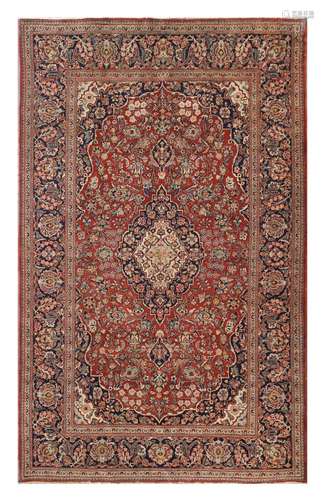 A FINE KASHAN RUG, CENTRAL PERSIA approx: 7ft. x 4ft.5in.(213cm. x 135cm.) This rug has good pile and is in very good usable condition. Good colour combination. Selvages original. Ends secured. Attractive and very good furnishing piece. ca.1920