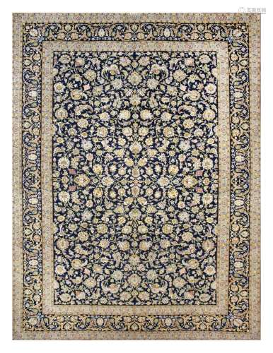 A FINE KASHAN CARPET, CENTRAL PEERSIA approx: 13ft.6in. x 9ft.11in.(412cm. x 302cm.) Unusual colour combination, seldom found in this type. Very good overall design and well drawn motifs. Very elegant arabesque border between floral and plain stripes.This carpet has full pile, soft wool quality and is in very good condition throughout. Ends with short fringes, secured. Selvages original. Attractive and very good furnishing piece. MId 20th Century