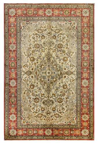 A VERY FINE SILK QUM RUG, CENTRAL PERSIA approx: 6ft.8in. x 4ft.4in.(204cm. x 135cm.) This rug has well blended soft colours. The pie is full, soft silk, Very fine weave, approx: 8 x 8 knots per sq. cm; woven on silk foundation. Selvages original. Very slight fraying at one end. In general very good usable condition. Attractive