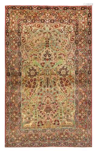 AN FINE ANTIQUE KIRMAN RUG, SOUTH PERSIA approx: 7ft.1in. x 4ft.5in.(215cm. x 135cm.) Very nicely drawn Mille-fleur design with floral vases, flowering vine, birds and animals. Very good colour combination. This rug has good pile. Selvages original. Ends with short fringes, secured. Fine weave, approx: 6 x 6 knots per sq. cm. In general this rug is in very good condition throughout. Attractive piece. ca.1900