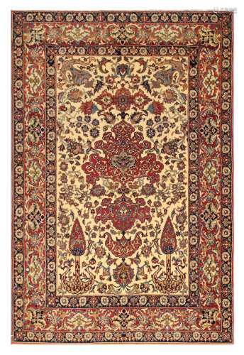 A VERY FINE ISFAHAN RUG, CENTRAL PERSIA approx: 7ft.2in. x 4ft.9in.(218cm. x 145cm.) Beautifully drawn design with very good colour combination. Bold appearance. This rug has full pile, kurk wool quality, soft and lustrous. In general this piece is in very good condition. Selvages are rebound, well done. Ends with short fringes, secured. Vey fine weave. approx; 8 x8 knots per sq. cm. Very attractive and lovely furnishing piece. ca.1920