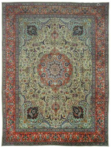 A FINE TABRIZ CARPET, NORTH-WEST PERSIA approx: 12ft.10in. x 9ft.9in.(392cm. x 326cm.) The sandy-beige field with scrolling arabesques, various palmettes, floral and leafy vine around cusped apricot and dusty pink double medallion with pendants. Soft pistachio-green spandrels with palmette, arabesques birds and animal figures. All surrounded by similar design border between arabesques, floral meander and plain stripes. This carpet has very good pile, fine wool quality. Selvages original. Ends with short fringes, secured. Fine weave, approx: 6 x 6 knots per sq. cm; In general this piece is in very good condition throughout. Attractive and very good furnishing piece. ca.1940