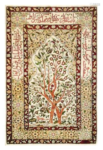 AN EXTREMELY FINE SILK HEREKE PRAYER RUG, TURKEY approx: 3ft.10in. x 2ft.7in.(117cm. x 79cm.) This rug has full pile and very good colour combination with ivory field. Design is well drawn with flowering trees and perching birds. Apricot floral mihrab above. All surrounded by floral motifs and inscription cartouches border between flowering vine stripes. Fine silk quality and extremely fine weave approx: 12 x 11 knots per sq.cm; woven on silk foundation. Ends with long fringes, original. Selvages also original. Signature at one end. touches of tiny discolouration in few very small places, barely visible. In general this rug is in very good condition throughout . Attractive piece. mid 20th century.