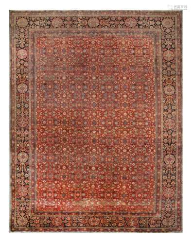 AN ANTIQUE MOCHTASHEM KASHAN CARPET, CENTRAL PERSIA approx: 13ft.1in. x 10ft.(399cm. x 305cm.) The filed with overall design of stylised open leafy panels, together with rosettes, palmettes and angular floral vine. In classic border for this type with bold multicoloured palmettes and angular floral vine between floral meander and reciprocal skittle-pattern stripes. Localized wear on the field, down to knot collar, showing dot like warps. Old repiling at one end, slightly fading with the age. Small hole and split at the edge of border towards one corner. One end original. Other end with slight fraying but no loss to guard stripe. Fine weave, approx: 8 x 8 knots per sq. cm. Selvages original with slight fraying. Beautiful quality, seldom found in the sales in the carpet size. Attractive and south after type. ca.1890's