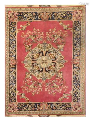 A VERY FINE PART SILK TABRIZ RUG, NORT-WEST PERSIA approx: 7ft.1in. x 5ft.1in.(215cm. x 155cm.) Very nicely drawn design with stylised large medallion, scrolling arabesques and floral vine. Unusual open spandrels with human face arabesques. All surrounded by border of arabesques, birds and floral tendrils between reciprocal and plain stripes. This rug has full pile of soft wool quality and part silk. The pile is full, very finely woven piece, approx: 9 x 8 knots per sq. cm; woven on silk warps. Original silk floral cartouche kilim at each end. Selvages original. In general this rug is in very good condition throughout. Attractive. Mid 20th century.