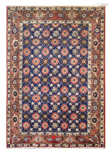 A FINE VERAMIN RUG, NORTH PERSIA approx: 7ft.3in. x 4ft.10in.(221cm. x 150cm.) Classic Mina-Khani design with multicoloured rosettes and angular vine. In bold turtle-palmette border between floral and plain stripes. Ends with short fringes. Selvages rebound, well done. This rug has full pile and is in very good condition throughout. Ca.1940's