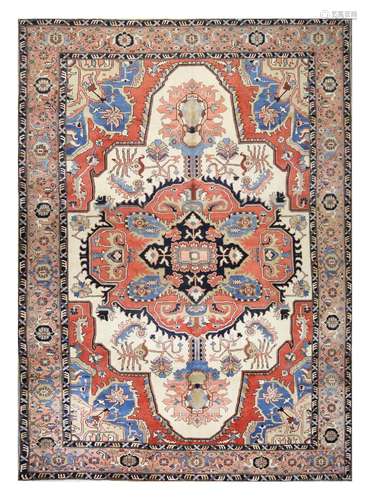 A FINE HERIZ CARPET, NORTH-WEST PERSIA approx: 15ft.11in. x 11ft.9in.(485cm. x 357cm.) The ivory field with classic bold design with large hooked and indented medallion with bold hooked palmette pendants. All surrounded by Dusty-pink border of stylised turtle-palmettes between hooked vine and plain stripes. This carpet is in very good condition throughout. Very good colour combination. Ends and selvages original. Very good furnishing piece. Attractive.