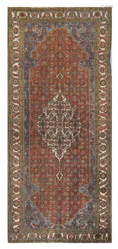 AN ANTIQUE NORTH-WEST PERSIAN KELLEH approx: 10ft.10in. x 4ft.8in.(329cm. x 142cm.) This carpet has slight overall wear to the top pile,. Ends secured, selvages with touches of wear on edges. Colours are well blended. In general this piece in in good usable condition. Attractive.
