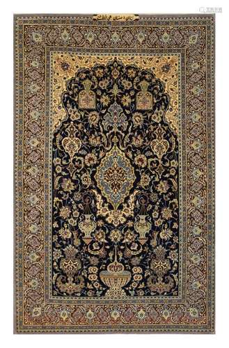 AN EXTREMELY FINE SIGNED PART SILK ISFAHAN RUG, CENTRAL PERSIA approx: 5ft.9in. x 3ft.7in.(175cm. x 109cm.) This rug has full pile, kurk wool quality and silk infusion. Design is well drawn, good colour combination. Ends and selvages original. extremely fine weave, approx: 10 x 10 knots per sq. cm; woven on silk foundation. Excellent condition throughout. Attractive. Woven, ca.1950's