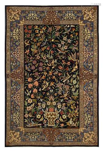 AN EXTREMELY FINE PART SILK ISFAHAN RUG, CENTRAL PERSIA approx: 5ft.7in. x 3ft.8in.(170cm. x 112cm.) Very nicely drawn design with floral and leafy sprays together with flowering vase and perching birds. This rug has full pile , top quality kurk wool and silk infusion surrounded by very elegant arabesque border. Ends and selvages original. Extremely fine weave, approx: 11 x 10 knots per sq, cm; woven on silk foundation. Very good condition throughout, ca.1950