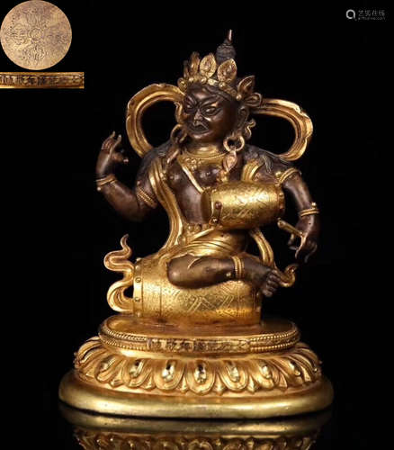 A GILT BRONZE MOLDED BUDDHA STATUE