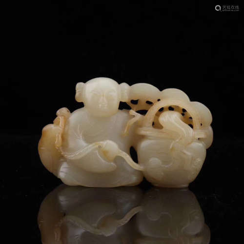 A HETIAN JADE CARVED CHILD SHAPED PENDANT