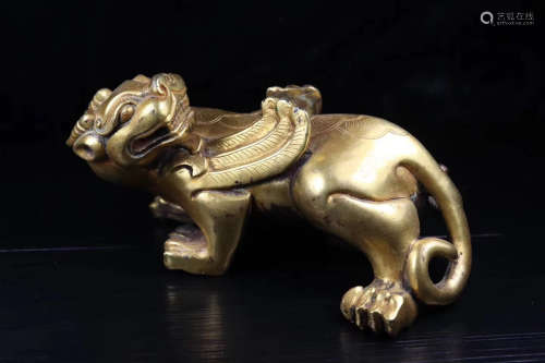 A GILT BRONZE BEAST FIGURE