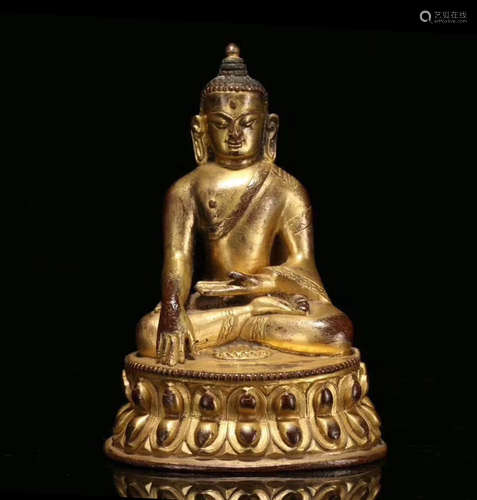 A GILT BRONZE MOLDED SAKYAMUNI BUDDHA STATUE