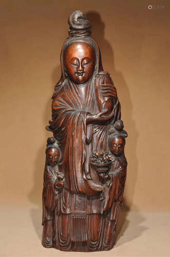 A BAMBOO CARVED GUANYIN STATUE