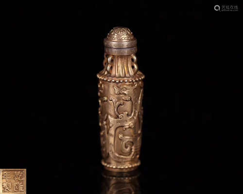 A GILT BRONZE MOLDED SNUFF BOTTLE