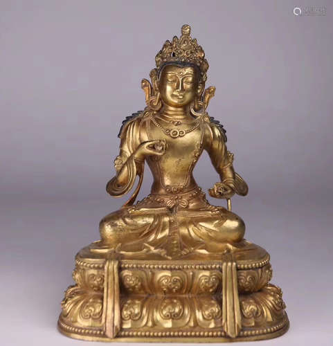 A GILT BRONZE MOLDED BUDDHA STATUE