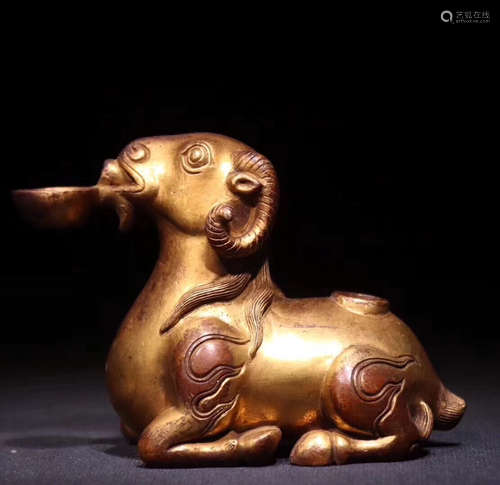 A GILT BRONZE MOLDED SHEEP SHAPED ORNAMENT