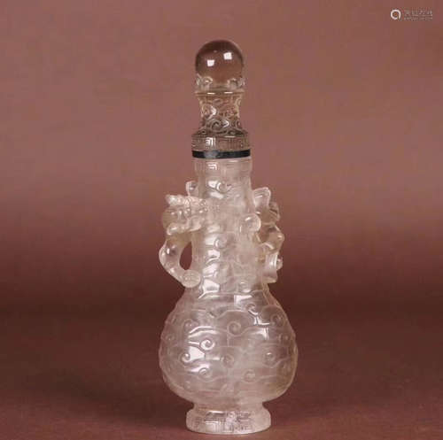 A CRYSTAL CARVED SMALL BOTTLE VASE