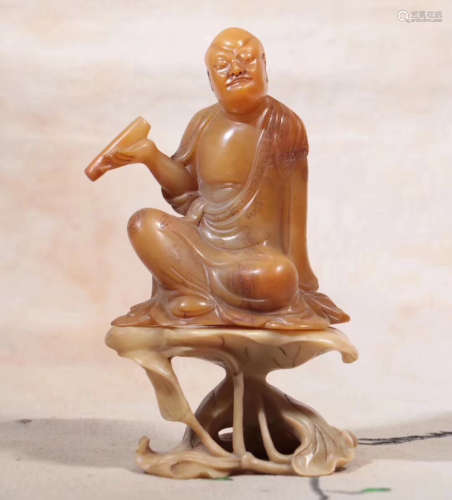 A SOAPSTONE CARVED LUOHAN FIGURE