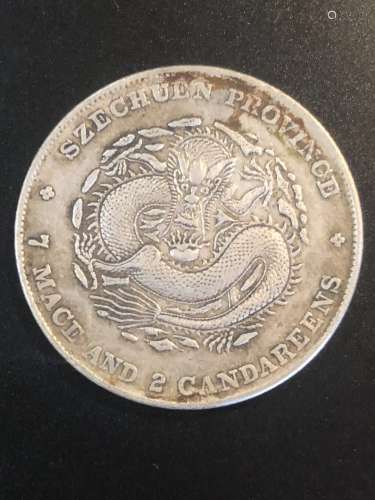A DRAGON PATTERN COIN WITH XUANTONGYUANBAO
