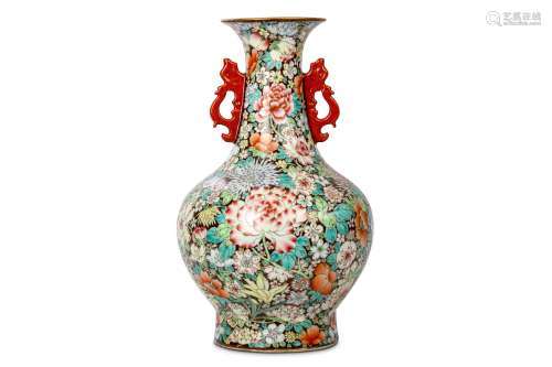 A CHINESE MILLEFLEUR VASE. 19th / 20th Century. The rounded body with a waisted neck and everted
