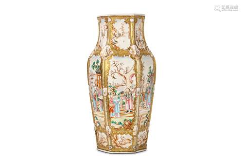 A CHINESE CANTON FAMILLE ROSE VASE. Qing Dynasty, 18th Century. Of hexagonal baluster form, the