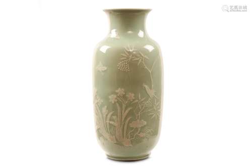A CHINESE SLIP-DECORATED CELADON LANTERN VASE. Qing Dynasty, Qianlong mark and of the period.