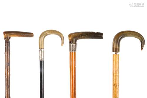 FOUR WALKING CANES WITH RHINOCEROS HORN HANDLES. Circa 1920. (4) 約一九二零   鑲犀角拐杖四隻