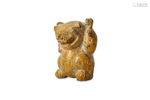 A CHINESE JADE CARVING OF A SEATED BEAR. Han dynasty, or later. The animal seated with the ams bent