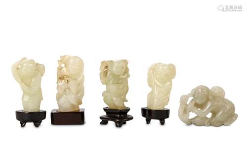 FIVE CHINESE JADE CARVINGS OF BOYS. 19th / 20th Century. Four standing holding a lotus spray,