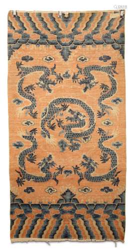 A CHINESE 'DRAGON' CARPET. Early 20th Century. Of rectangular form and vertically orientated, woven