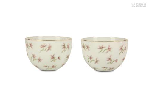 A PAIR OF CHINESE ENAMELED WINE CUPS. The deeply rounded sides of the body decorated with flower