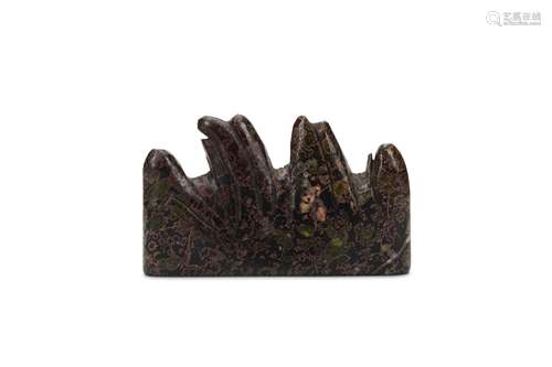 A CHINESE PUDDINGSTONE 'MOUNTAIN PEAK' BRUSHREST. Qing Dynasty. Carved with four peaks, the stone