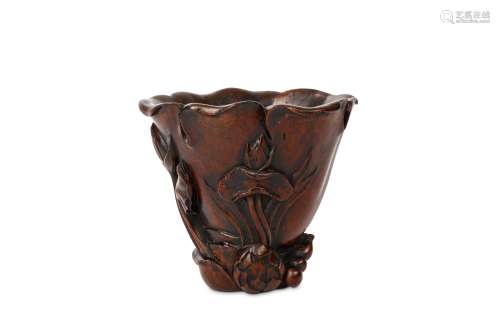 A CHINESE CARVED XIANGMU ‘LOTUS LEAF’ LIBATION CUP Of conical form, carved in the form of a lotus