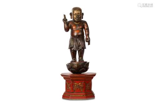 A CHINESE GILT-LACQUER FIGURE OF THE INFANT BUDDHA. Qing Dynasty. Standing in a loincloth, his