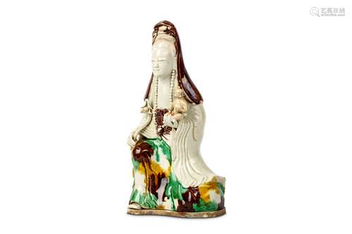 A FAMILLE VERTE FIGURE OF GUANYIN. Qing Dynasty, Kangxi era. The goddess seated holding a ruyi