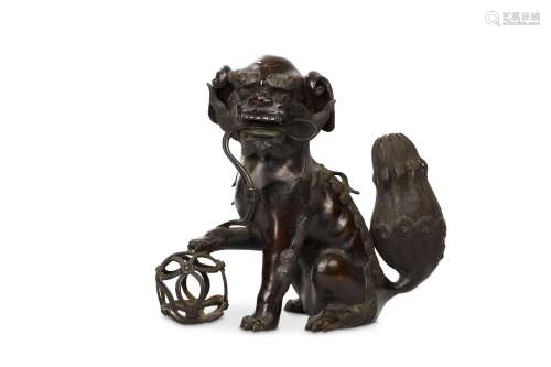 A CHINESE BRONZE ‘BUDDHIST LION DOG’ INCENSE BURNER. Ming Dynasty. Seated with the left front paw