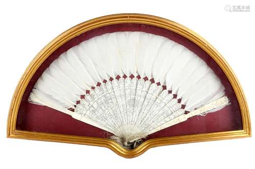 A CHINESE FEATHER AND IVORY FAN. 19th Century. Carved to form a continuous garden scene across the