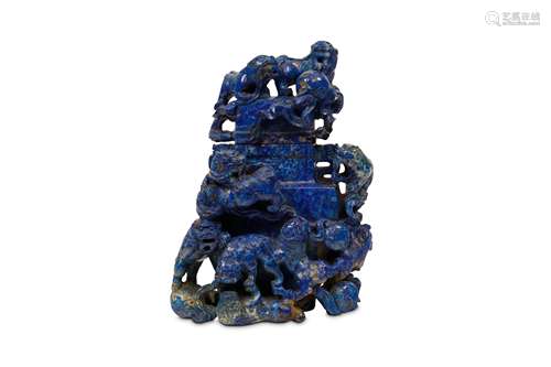 A CHINESE CARVED  LAPIS LAZULI VASE AND COVER. 20th Century. Of rectangular baluster form, carved