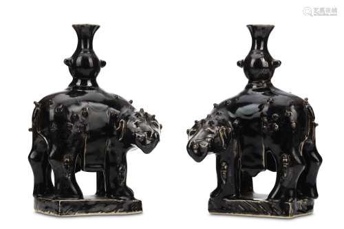 A PAIR OF CHINESE BLACK-GLAZED ELEPHANTS. Qing Dynasty, 19th Century. Standing four-square in