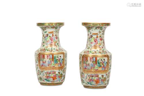 A PAIR OF CHINESE FAMILLE ROSE CANTON VASES. Qing Dynasty, 19th Century. Of baluster form with