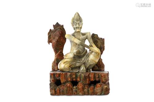 A CHINESE SOAPSTONE CARVING OF SIDDHARTHA. Qing Dynasty, 19th Century. The emaciated figure seated