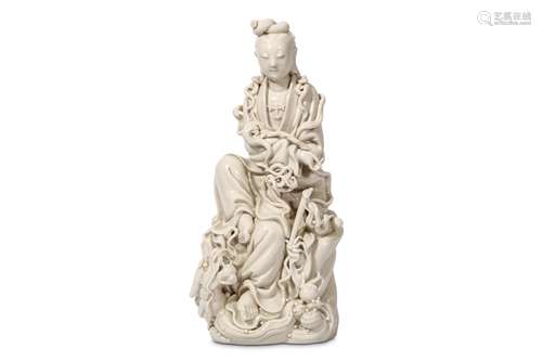 A CHINESE BLANC DE CHINE FIGURE OF GUANYIN. Late Qing Dynasty. Seated in flowing robes, a fly wisp