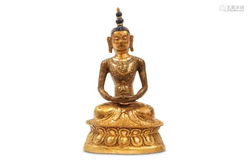 A GILT METAL REPOUSSE SEATED BUDDHA. Qing Dynasty, 18th Century. Seated with hands together on a