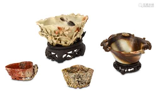 THREE CHINESE SOAPSTONE LIBATION CUPS AND A HARDSTONE 'BATS' CUP. Qing Dynasty. The two smaller