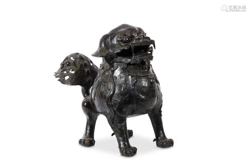 A LARGE CHINESE BRONZE ‘BUDDHIST LION DOG’ INCENSE BURNER. Ming Dynasty. Standing four square with