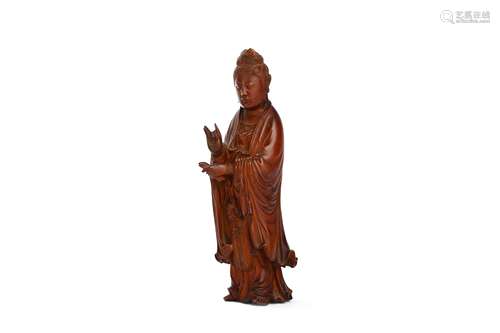 A CHINESE CARVED BOXWOOD FIGURE OF GUANYIN. Qing Dynasty, 18th Century. Finely carved in long