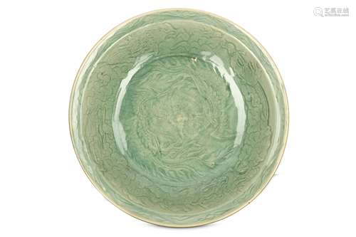 A CHINESE LONGQUAN CELADON ‘ DRAGON AND PHOENIXES’ CHARGER. Ming Dynasty. The interior with a