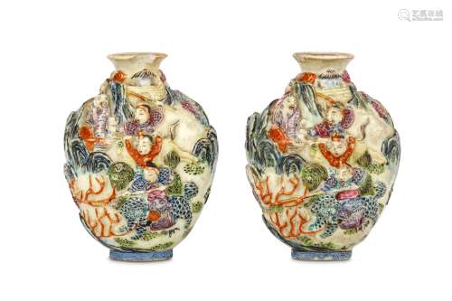 A PAIR OF CHINESE MOULDED FAMILLE ROSE SNUFF BOTTLES. Late Qing Dynasty. Moulded and painted with